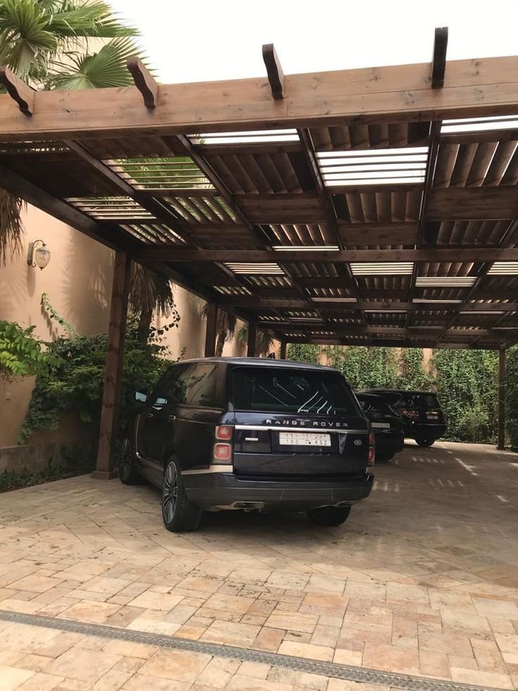 تغطية مواقف السيارات بمظلات عصرية في حي الياسمين الرياض